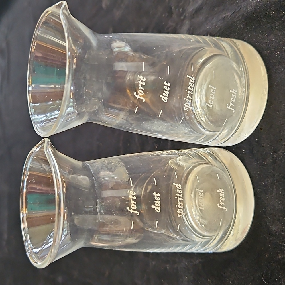 Set of 2 mini decanter or small measuring glass likely for wine or other liquids